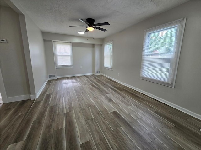 2381 Culver Rd, Irondequoit, NY 14609 - empty room featuring dark wood-type flooring, ceiling fan, and a textured ceiling