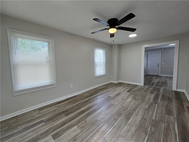 2381 Culver Rd, Irondequoit, NY 14609 - spare room featuring wood finished floors and a ceiling fan