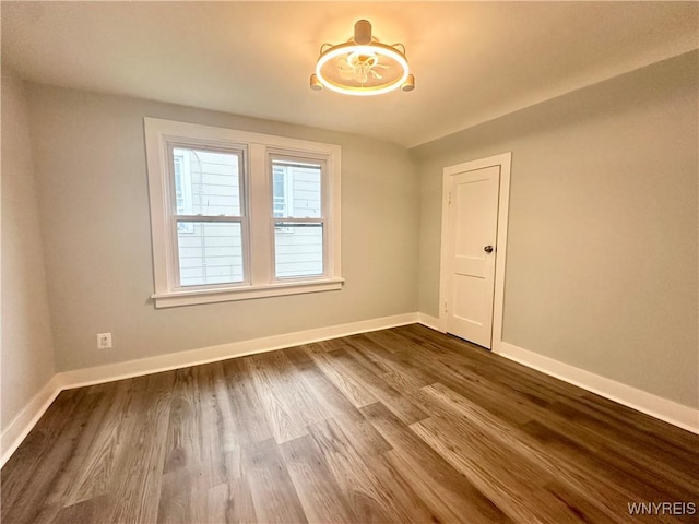 1433 Eggert Rd, Amherst, NY 14226 - unfurnished room featuring dark wood-type flooring and baseboards