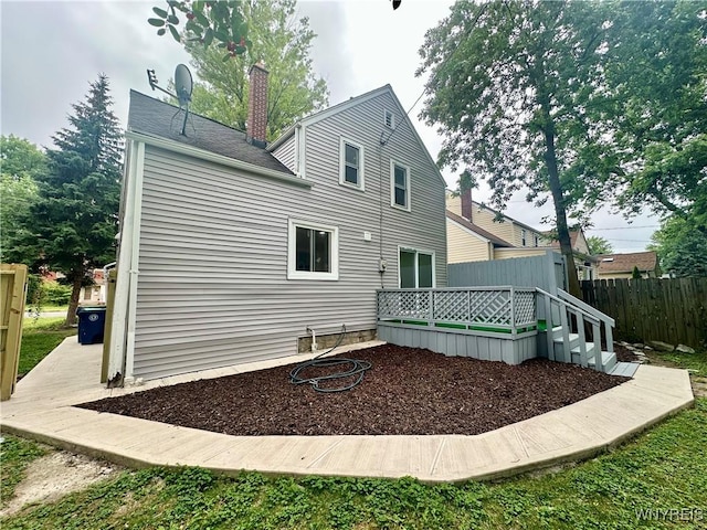 1433 Eggert Rd, Amherst, NY 14226 - back of property featuring a wooden deck and a chimney