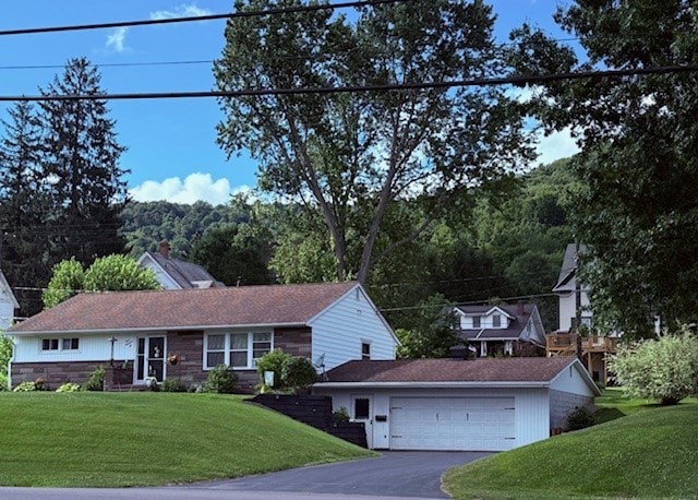 402 E Water St, Smethport Boro, PA 16749 - single story home featuring a front yard, an attached garage, and asphalt driveway