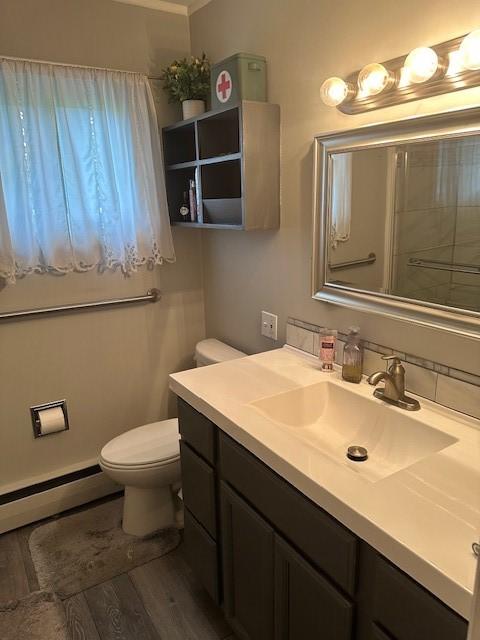 402 E Water St, Smethport Boro, PA 16749 - full bath featuring vanity, a baseboard radiator, and wood finished floors