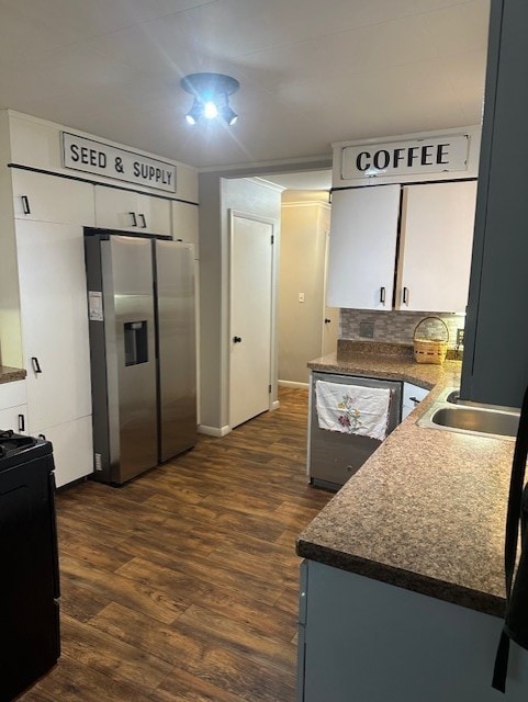 402 E Water St, Smethport Boro, PA 16749 - kitchen featuring stainless steel appliances, dark wood-style flooring, dark countertops, and tasteful backsplash