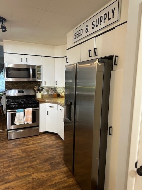 402 E Water St, Smethport Boro, PA 16749 - kitchen with appliances with stainless steel finishes, dark countertops, white cabinetry, and dark wood-style floors
