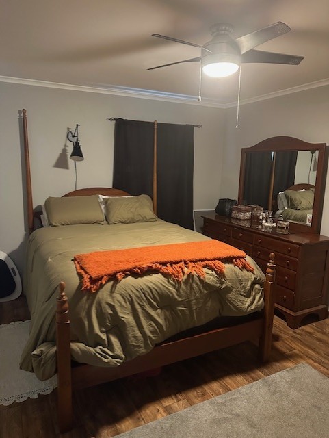 402 E Water St, Smethport Boro, PA 16749 - bedroom featuring ornamental molding, wood finished floors, and ceiling fan