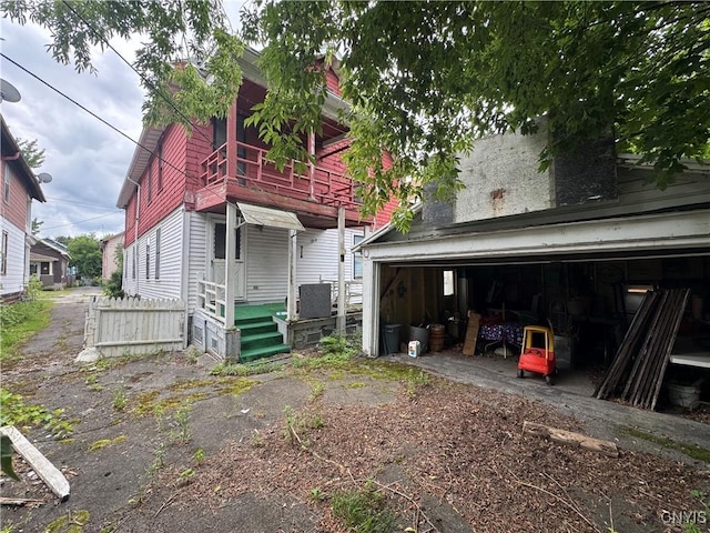 118 Barton Ave Unit 116, Utica, NY 13502 - back of house featuring a garage and an outdoor structure