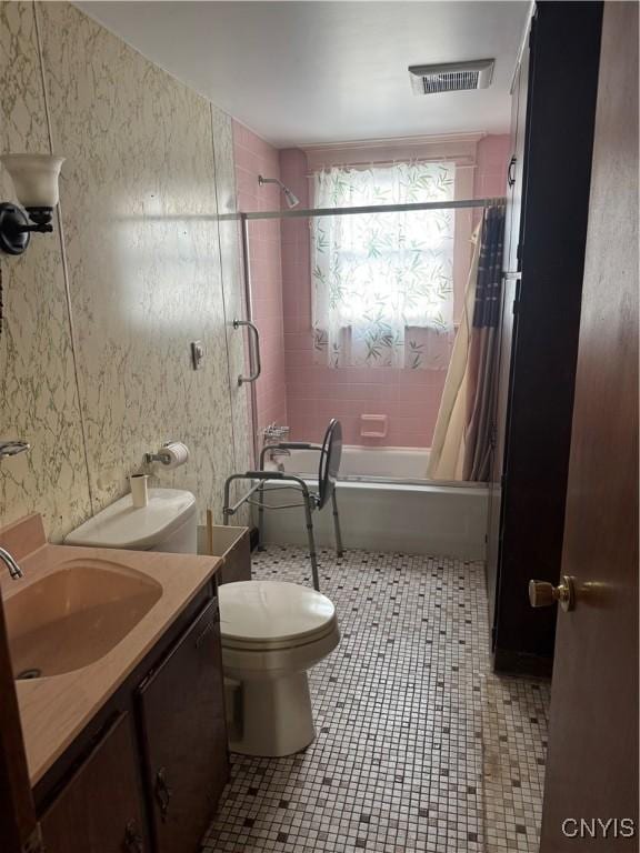 118 Barton Ave Unit 116, Utica, NY 13502 - bathroom featuring vanity, shower / bath combo with shower curtain, tile patterned floors, and wallpapered walls