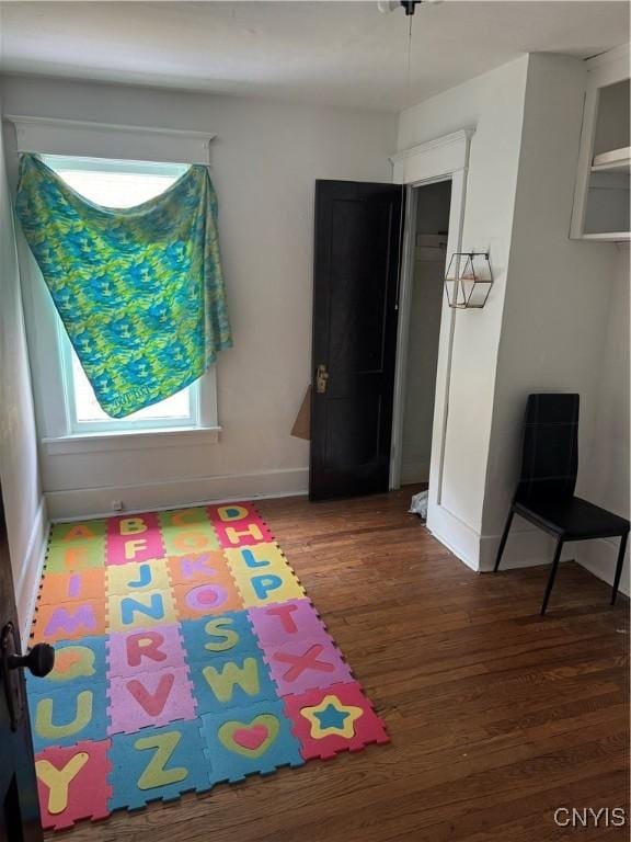 118 Barton Ave Unit 116, Utica, NY 13502 - rec room with wood finished floors and baseboards
