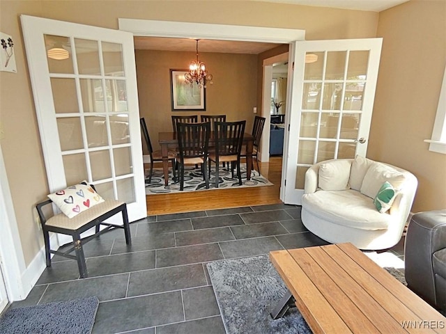 37 Woodmar Ter, West Seneca, NY 14224 - interior space featuring dark tile patterned flooring and a chandelier