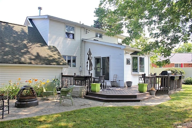 37 Woodmar Ter, West Seneca, NY 14224 - back of property featuring an outdoor fire pit, a deck, a patio area, and a shingled roof