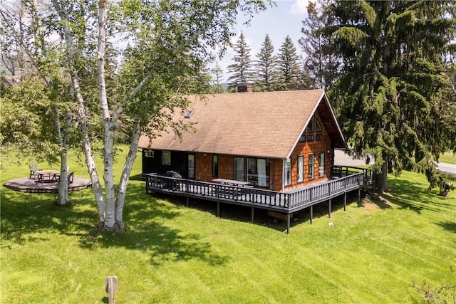 2064 County Highway 8, Roxbury, NY 12421 - rear view of property featuring a lawn, a shingled roof, a deck, and a chimney