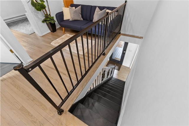 2064 County Highway 8, Roxbury, NY 12421 - staircase with wood finished floors and a baseboard radiator