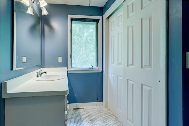21 Spring Hl, Perinton, NY 14450 - bathroom with tile patterned floors, vanity, and plenty of natural light