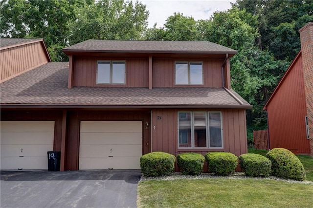 21 Spring Hl, Perinton, NY 14450 - view of front facade with a shingled roof, asphalt driveway, and a garage