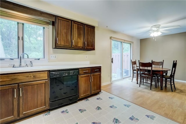 21 Spring Hl, Perinton, NY 14450 - kitchen featuring black dishwasher, light countertops, ceiling fan, and light wood-style floors