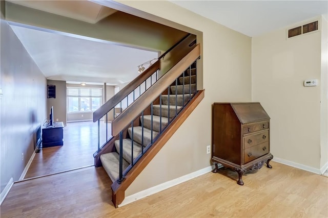 21 Spring Hl, Perinton, NY 14450 - staircase featuring wood finished floors and baseboards