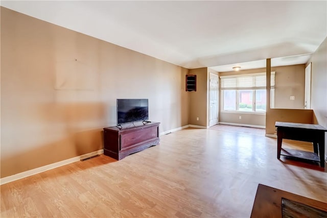 21 Spring Hl, Perinton, NY 14450 - unfurnished living room with baseboards and wood finished floors