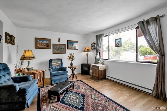 51 S 86th St Unit 10B, Niagara Falls, NY 14304 - living room featuring a baseboard heating unit and light wood-style floors