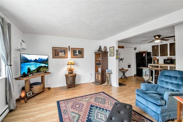51 S 86th St Unit 10B, Niagara Falls, NY 14304 - living area featuring wood finished floors, a ceiling fan, a baseboard heating unit, and a wall unit AC
