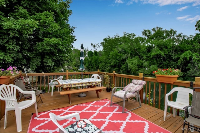 51 S 86th St Unit 10B, Niagara Falls, NY 14304 - wooden deck with outdoor dining area and view of scattered trees