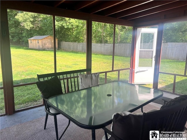 3420 Riverside Dr, Scio, NY 14895 - sunroom / solarium featuring a hot tub, outdoor dining area, and healthy amount of natural light
