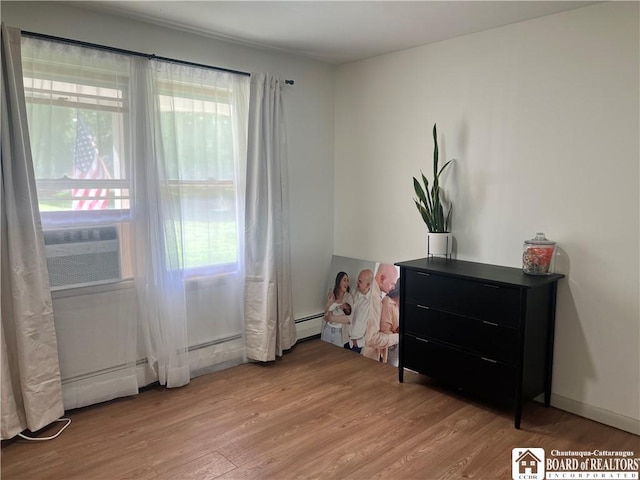 3420 Riverside Dr, Scio, NY 14895 - bedroom with wood finished floors and baseboard heating