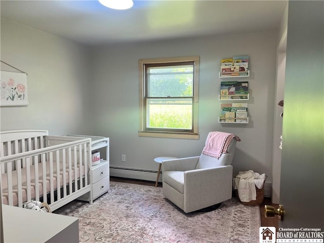 3420 Riverside Dr, Scio, NY 14895 - bedroom with baseboard heating and a crib