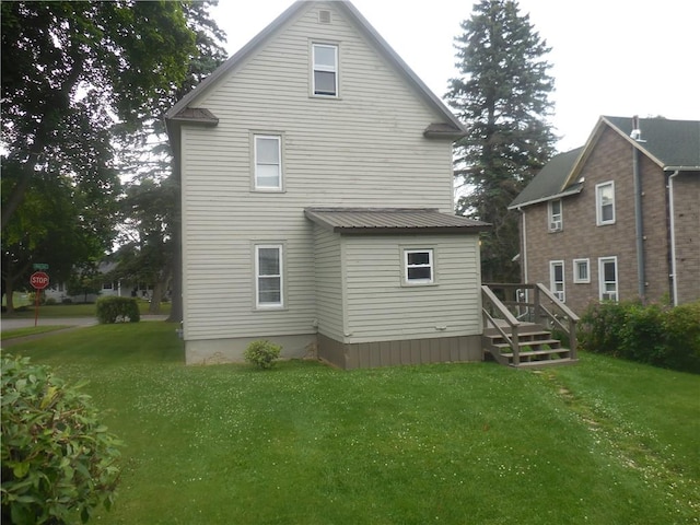 45 Olin Ave, Perry, NY 14530 - rear view of property featuring a yard and a metal roof