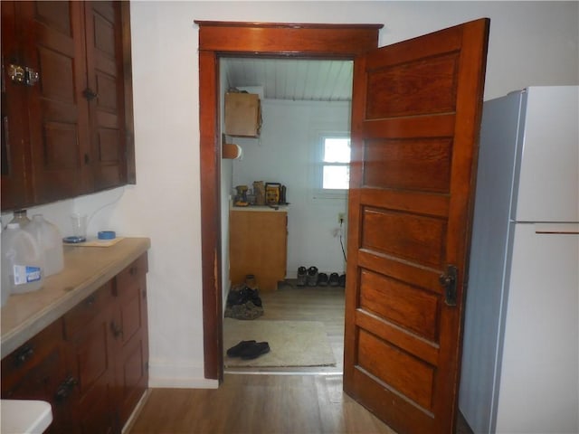 45 Olin Ave, Perry, NY 14530 - kitchen with freestanding refrigerator, wood finished floors, and light countertops