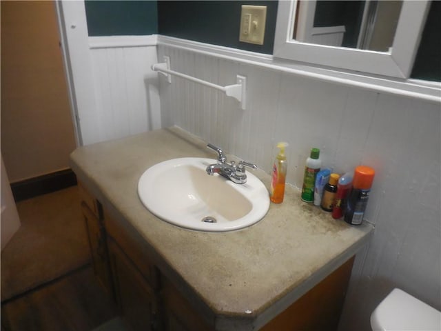 45 Olin Ave, Perry, NY 14530 - bathroom with vanity, a wainscoted wall, and a decorative wall