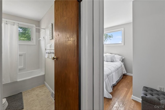 8500 Pools Brook Rd, Manlius, NY 13082 - bedroom with multiple windows and light wood-style flooring