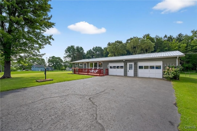 8500 Pools Brook Rd, Manlius, NY 13082 - ranch-style house featuring a front lawn, asphalt driveway, a deck, and a metal roof