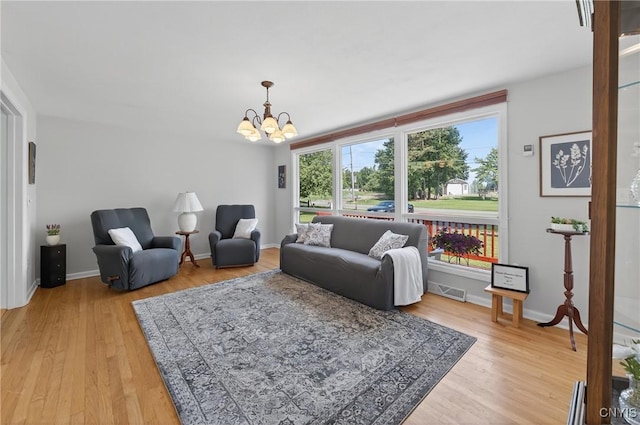8500 Pools Brook Rd, Manlius, NY 13082 - living room with a chandelier and light wood-style flooring