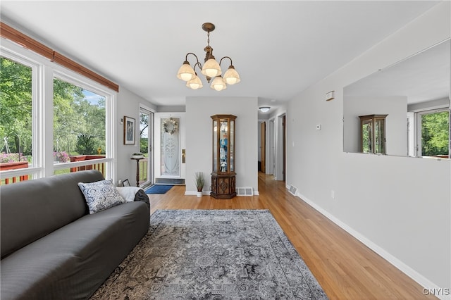 8500 Pools Brook Rd, Manlius, NY 13082 - living room featuring a chandelier and wood finished floors