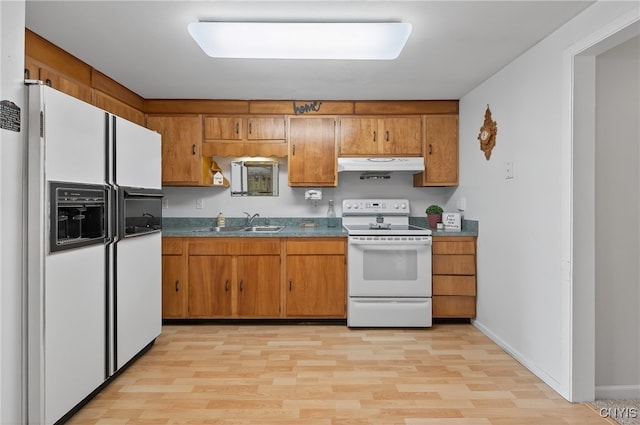 8500 Pools Brook Rd, Manlius, NY 13082 - kitchen with white appliances, under cabinet range hood, light wood-style floors, and brown cabinetry