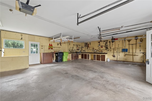8500 Pools Brook Rd, Manlius, NY 13082 - garage with a workshop area and a garage door opener