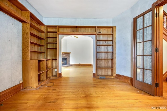 499 Breckenridge St, Buffalo, NY 14213 - corridor featuring light wood finished floors, arched walkways, and built in shelves