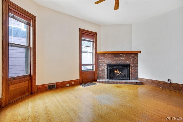 499 Breckenridge St, Buffalo, NY 14213 - unfurnished living room with light wood-style flooring, plenty of natural light, a fireplace, and a ceiling fan