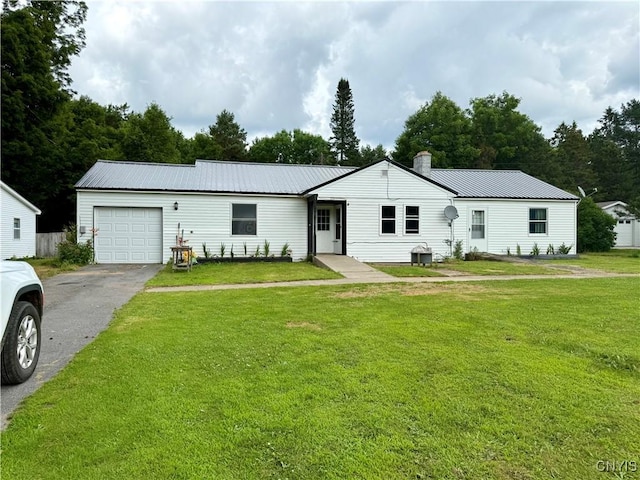 35381 State Route 3, Wilna, NY 13619 - ranch-style house featuring an attached garage, driveway, a metal roof, a front yard, and a chimney