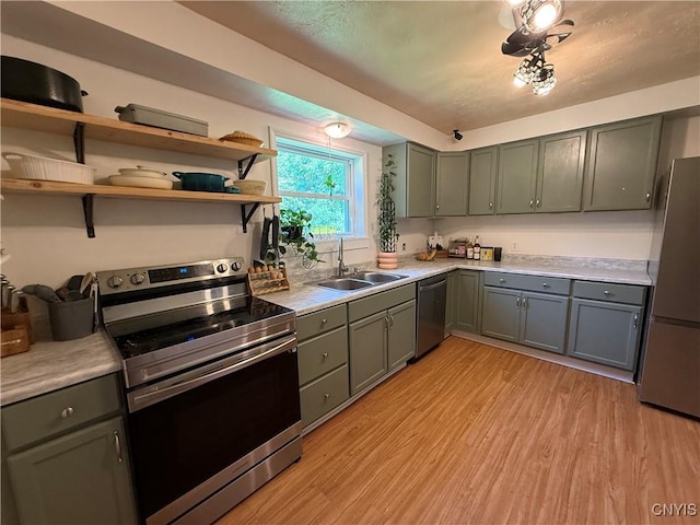35381 State Route 3, Wilna, NY 13619 - kitchen featuring appliances with stainless steel finishes, gray cabinets, light countertops, and light wood finished floors
