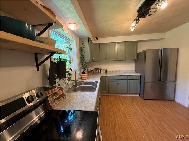 35381 State Route 3, Wilna, NY 13619 - kitchen featuring stainless steel appliances, light wood-type flooring, light countertops, and gray cabinets