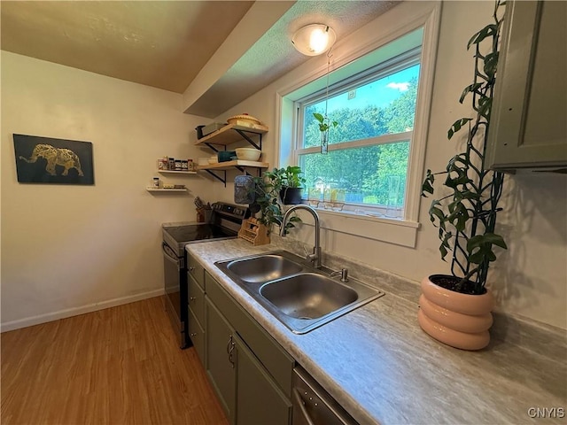35381 State Route 3, Wilna, NY 13619 - kitchen with stainless steel electric stove, light wood-type flooring, and light countertops