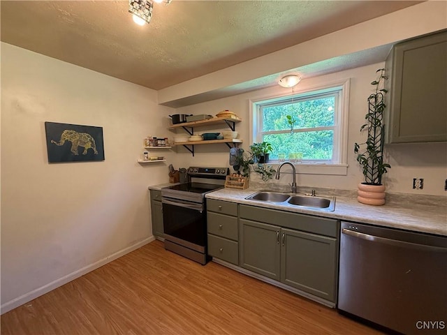 35381 State Route 3, Wilna, NY 13619 - kitchen featuring stainless steel appliances, gray cabinetry, light wood-style floors, light countertops, and open shelves