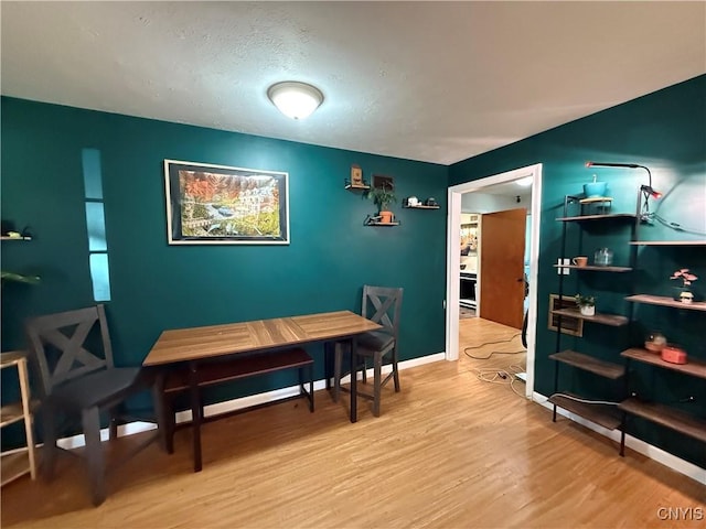 35381 State Route 3, Wilna, NY 13619 - dining room featuring wood finished floors and a textured ceiling