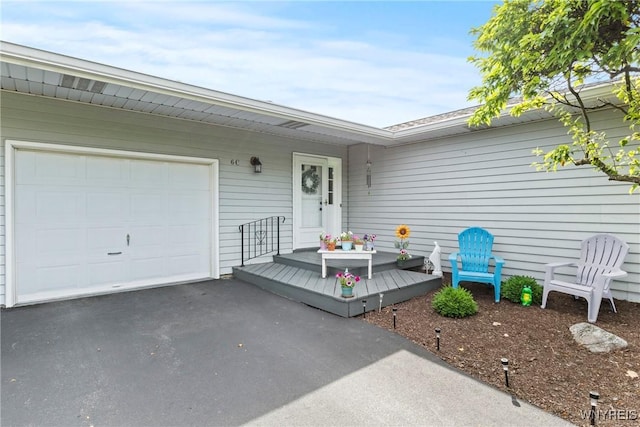 5861 Goodrich Rd Unit 6C, Clarence, NY 14032 - property entrance featuring an attached garage and driveway