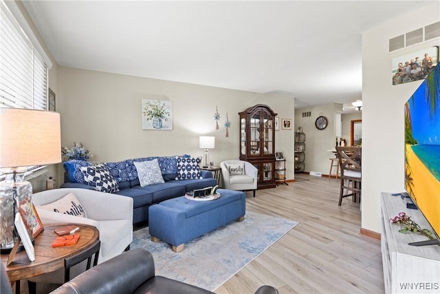5861 Goodrich Rd Unit 6C, Clarence, NY 14032 - living room with light wood-style floors and baseboards