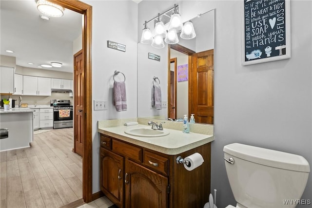 5861 Goodrich Rd Unit 6C, Clarence, NY 14032 - bathroom with vanity, wood finished floors, and recessed lighting