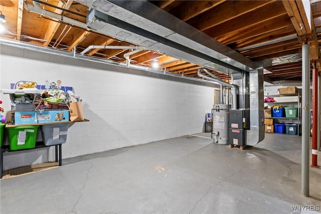 5861 Goodrich Rd Unit 6C, Clarence, NY 14032 - unfinished basement with water heater, heating unit, and concrete block wall