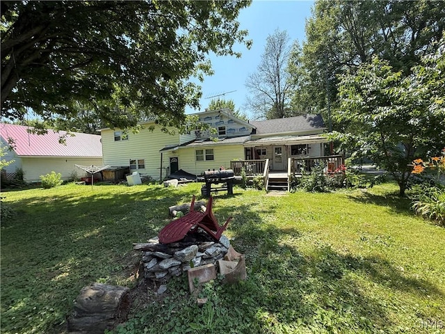 352 S Real St, Cape Vincent, NY 13618 - back of property with a deck and a yard