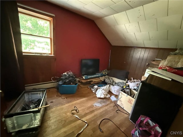 352 S Real St, Cape Vincent, NY 13618 - additional living space with vaulted ceiling, a baseboard heating unit, wood finished floors, and wood walls
